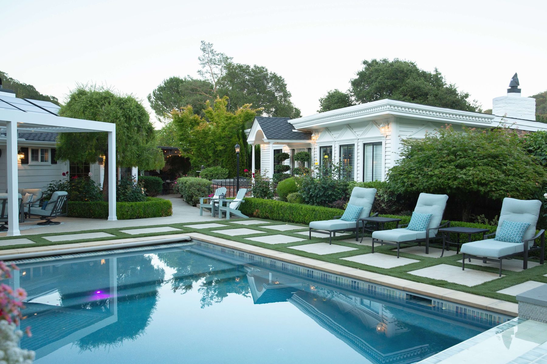 Swimming pool and planted terrace in a sunny Novato backyard